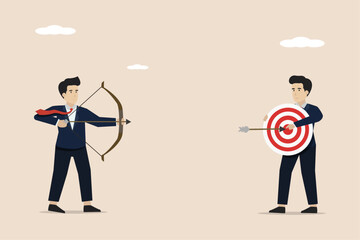 Wall Mural - focus on business goals, goals for career development concept, businessman aiming at target held by 