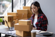 Startup Small Business Entrepreneur SME, Asian Woman Receive Order On Phone. Success Young Asian Small Business Owner Home Office, Online Sell Marketing Delivery, SME E-commerce Telemarketing Concept
