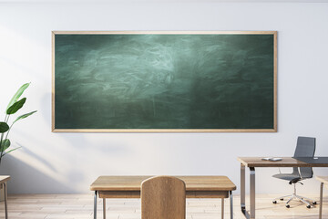 Poster - Modern classroom interior with empty mock up chalkboard, wooden furniture, daylight and equipment. Education, knowledge and workspace concept. 3D Rendering.