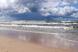 Fototapeta  - Baltic Sea coast and wild beach with rain clouds on the horizon, Poland