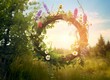 Rustic wildflowers wreath on a sunny meadow. Summer Solstice Day, Midsummer concept.
