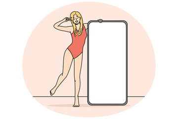 Wall Mural - Smiling woman in swimsuit posing with cellphone with mockup screen. Happy girl in bodysuit near smartphone with white copy space display. Influencer concept. Vector illustration.