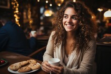 A Woman Eats Christmas Cookies With Coffee In A Cafe