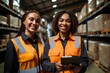 © Attasit - Happy female Employees in uniform Use a tablet to work in the warehouse