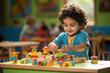 Indian cute little small girl playing with colourful building block toy on table