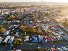 Housing Affordability Concept - Sunrise Over Residential Streets And Homes In Town