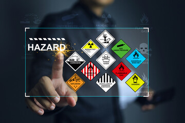 hazardous substance concept engineer pointing on hazard icon dangerous goods store in warehouse crea