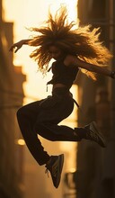 a woman jumping in the air on a skateboard with her hair blowing back in