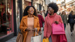 © Studio Nova - Two girlfriends is walking down the street with bags while shopping