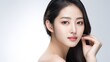Beautiful young Asian woman with clean fresh skin on white backdrop, with clean fresh skin Face care, facial treatment, commercial concept.