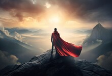 Businessman Superhero With Red Cape Standing And Looking On The Top Of Mountain Landscape Background
