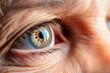 © mila103 - Close-up of the eye of an elderly man. Macro.