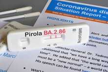 SARS‑CoV‑2 Antigen Test Kit For Self Testing With Positive Result With Text Pirola BA.2.86 On Grey Background. Close-up. Concept For The New Covid 19 Pirola Variant