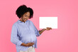 © Prostock-studio - Smiling millennial black pregnant mom with big belly shows banner with free space, enjoy expect baby