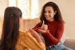 © Prostock-studio - Arabic deaf mute mother and daughter using sign language indoor