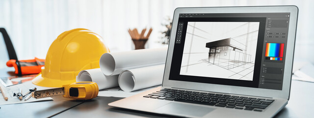 Digital blueprint by architecture design software on laptop screen with documents and blueprint layout on office table seamless integration of technology and traditional drafting method. Insight