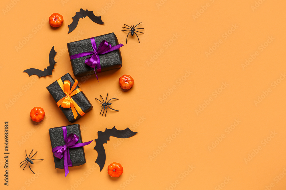 Composition with gifts and Halloween decorations on color background