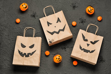 Sticker - Composition with shopping bags and decorations for Halloween on dark background