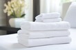 Hotel Cleanliness and Hygiene: Neatly Stacked White Towels and Flower decoration. Digital Ai