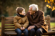 © AspctStyle - Happy grandson talking to his grandfather while sit in public park