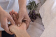 © daniromphoto - Female physiotherapist giving patient a hand massage, close up shot.
