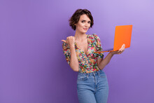Photo Portrait Of Young Lady Point Empty Space Orange Laptop Dressed Stylish Flower Print Garment Isolated On Purple Color Background