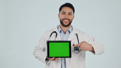 Poster - Doctor, medical and tablet green screen for clinic presentation, website or registration in studio. Face of healthcare man of digital mockup, telehealth service or tracking marker on white background