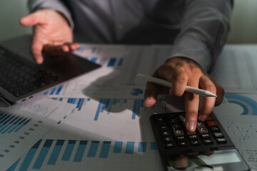 Aufkleber - close-up of a businessman using a computer laptop to analyze finances and calculate investment data paperwork money report tax refund cost Accounting and Banking Concept