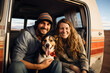 happy couple on road trip with dog