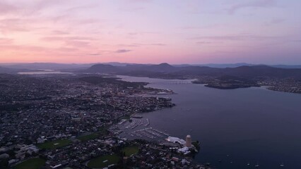 Sticker - Hobart, Australia: Aerial drone footage of a cinematic sunset over the Hobart city in Tasmania main city in Australia from the Mount Nelson viewpoint