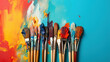 A collection of paintbrushes on colorful background