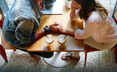 Wall Mural - Romantic loving couple drinking coffee, having a date in the cafe.