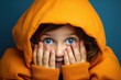 Shy Child peeking through fingers against a solid color background - AI Generated