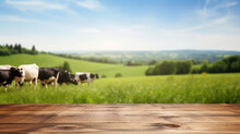 Empty Wooden Table Top With Blur Background Of Cows Pasture
