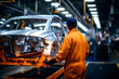 © Tidarat - worker in car manufacturing factory on background