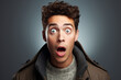young man expressing surprise and shock emotion with his mouth open and wide open eyes. isolated on color background