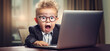 © Yeti Studio - Surprised cute kid staring at laptop screen in office. Copy space