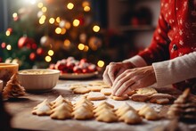 A Person Making Christmas Cookies On A Table With A Christmas Tree In The Background. Imaginary Photorealistic Image.