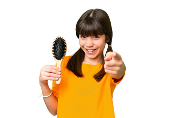 Wall Mural - Little caucasian girl with hair comb over isolated background points finger at you with a confident expression