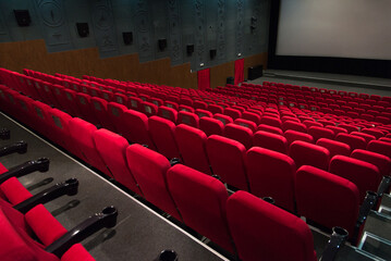 Wall Mural - An empty cinema room with red velvet seats. Empty cinema.	