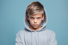 Anger European Boy In Gray Hoodie On Pastel Background