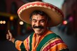 © Tayyaba - Mexican man Celebrating Cinco de Mayo National Holiday wearing sombrero and bright poncho