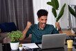 © Andre Nery - Young Man Doing Home Office During the day at desk With Laptop