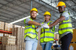 © Nunkung - Group of engineers men and woman stack of hands showing unity and teamwork in car parts factory.