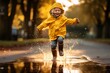 A kid playing in a rain puddle