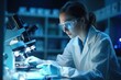 © dragan jovic - A female scientist looking through microscope