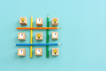 Poster - bright light bulb and question mark with pencils concept image of