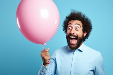 Canvas Print - A man with a beard holding a pink balloon. This image can be used to represent joy, celebration, and happiness.