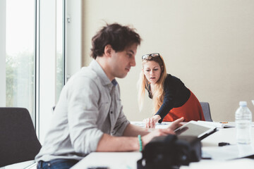 two colleagues having meeting in modern coworking office