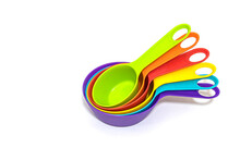 Set Of Colorful Plastic Measuring Spoons. Kitchen Equipment. Isolated On White Background.